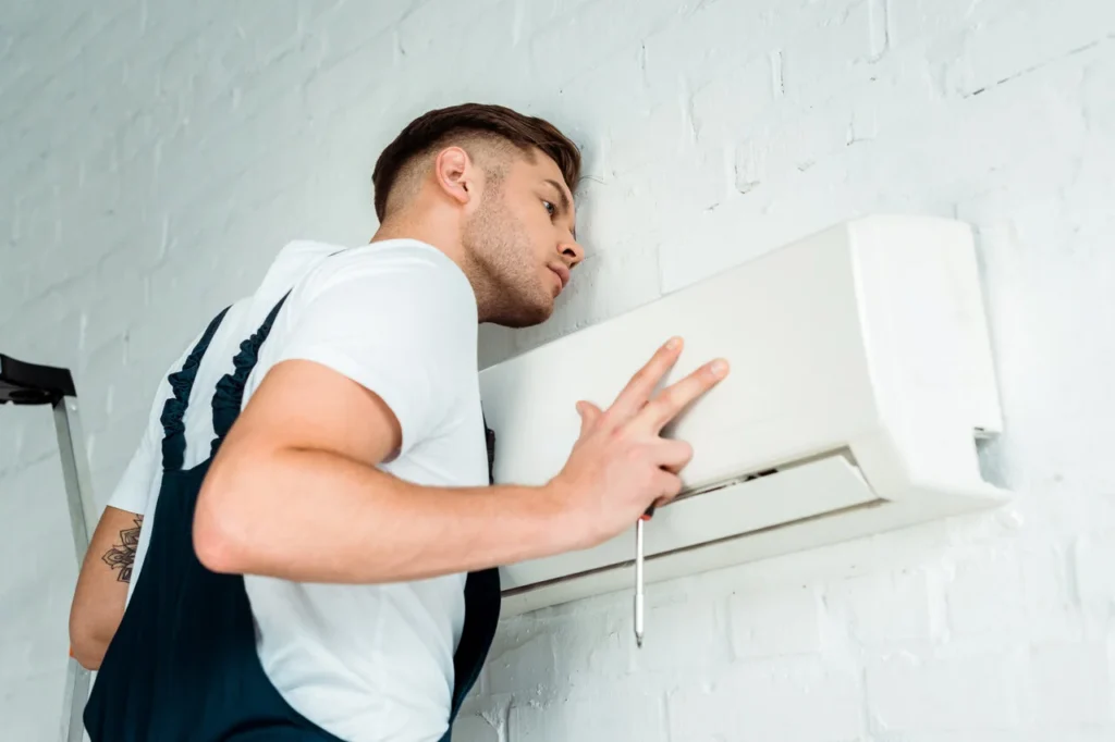 Worker Installing Air Conditioner 10